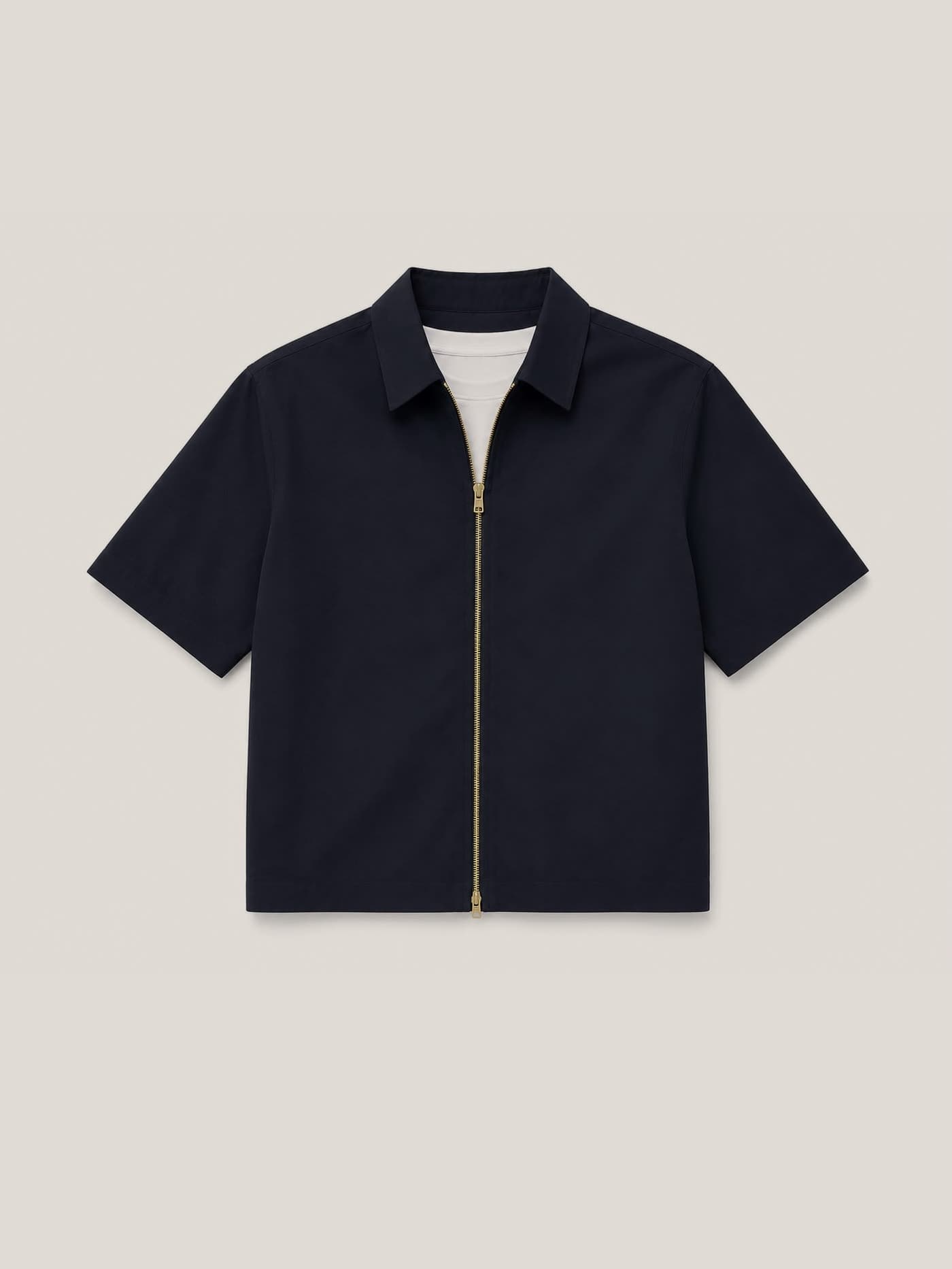 The navy overshirt laid flat, spread collar and gold double-pull zip